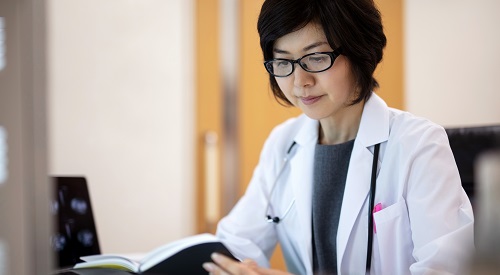 HCC Research Image of doctor reviewing an article