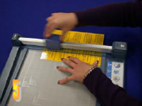 Photo of sheets being lined up on paper trimmer